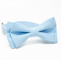 This little boys bowtie is so adorable and cute! Your little guy will look his very best!  The perfect bow tie for your little one. Wear this bowtie to church, a wedding, for a birthday, as a photo prop or just to dress up your little guy.  The shown bow tie measres 1 1/2" x 3 3/4". (spot clean only) * choose the attachment: please note months or ages.  - Clip on - Adjustable strap  : Neck-strap is adjustable with slider for easy on and off. Fit for all size neck.  More Sizes Available - Please Blue Bow With Bow Tie Back For Wedding, Blue Bow Tie With Bow Tie Back For Weddings, Blue Bow Tie For Wedding, Blue Bow Tie For Wedding And Father's Day, Blue Wedding Bow Tie With Bow Tie Back, Blue Bow Tie With Bow Tie Back For Groom, Dapper Blue Bow Tie For Groom, Blue Standard Bow Tie For Groom, Adjustable Bow Tie For Groom