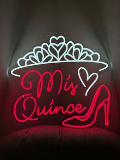 a neon sign that says miss quince on the side of a chair in front of a wall