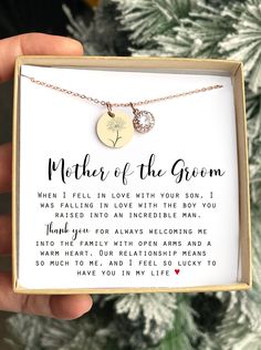 a mother of the bride necklace in a gift box with a poem on it that reads,