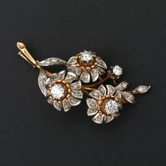 Antique brooch in yellow gold (18k) with flower patterns decorated with natural diamonds, the largest of which are white of about 0.35 ct each. They are surrounded by pink-cut diamonds. Gross weight: 14.30 g. Dimensions: 53 x 25 mm And many other great pins on our website: www.ohmybrooch.com Additional information: We issue an invoice and a certificate of authenticity issued by our qualified gemologist (LFG Paris). Our photos are not reworked and are taken in an environment of natural light. We Wedding Bouquet Jewelry, Bouquet Jewelry, Jewelry Brooch, Gold Brooch, Antique Brooches, Diamond Brooch, Indian Wedding Jewelry, Gold Brooches, Gold Gold