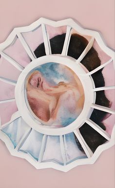 a painting of a woman's head in a circular mirror