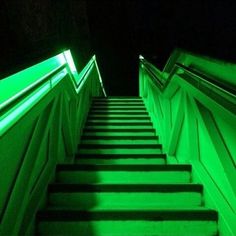 a set of stairs lit up with green light