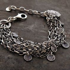 "charms layered multi strand chain bracelet handmade of oxidized 925 sterling silver, signed, © ewa lompe APPROXIMATE MEASUREMENTS: total length: 18 -21.5 cm + 4 cm adjustable chain or 7 -8.5\"+ 1.6\" adjustable chain handmade raw charms size ( 12 pics): 5-7 mm bigger charm size: 17 mm lobster clasp: 16 mm Layering pieces combine to form one gorgeous sterling silver layered chains bracelet. Nineten sweeping multi strand chains made from high quality 925 silver flow around the wrist in a beautifu Sequin Bracelet, Multi Strand Bracelet, Unique Gifts For Women, Layered Chains, Silver Chain Bracelet, Silver Jewelry Handmade, Moon Charm, Layered Bracelets, Oxidized Silver