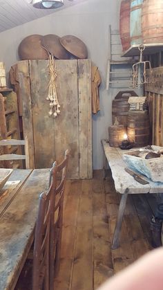 an old wooden table and chairs in a room