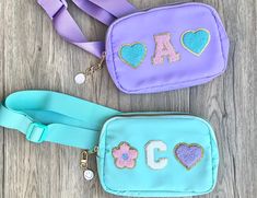 Our custom toddler purse is a delightful crossbody bag, personalized specifically for girls, making it an ideal birthday gift for nieces or tween girls. This unique fanny pack is a thoughtful present, offering both practicality and style for any little girl to enjoy. 💜BAG DETAILS: -waterproof  -toddlers/young children can wear them crossbody  -teens/adults wear as a waist bag/crossbody bag/chest bag/bum bag -two pockets (main pocket and back pocket) -add an adorable happy face bag charm (comes in random color) -size/shape/color of the bag may vary slightly due to supply/availability -bag dimensions are approximately 5.5" X 8" X 2" -strap is adjustable (31" - 45") PATCHES: -customize with letter/shape patches (see listing photo for options) -up to 3 patches will be arranged in a straight l Personalized Playful Blue Bag, Playful Personalized Blue Bag, Personalized Playful Bags For Gifts, Playful Personalized Bags For Gifts, Purple Bags For End Of School Year Gift, Trendy Bags For End Of School Year Gifts, Toddler Purse, Bag Patches, Niece Gifts