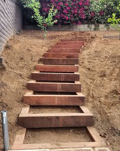 the steps are made out of wood and ready to be built into the garden area