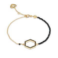 A unique hexagon hand crafted bracelet. Features a cubic zirconia hexagon charm that is linked with tiny sparkly spinel 2mm faceted gems on one side and with a gold chain on the other.  Set in 18k gold plated sterling silver.   Wear it on its own for a unique signature look or stack this piece with other bracelets. Measures 18cm in total including 2cm extendable chain. Though I would be happy to craft a slightly smaller or larger size bracelet to fit your wrist perfectly. Details: 18k gold plated sterling silver sparkly black spinel 2mm hexagon charm embellished with black zirconia open ring clasp 5,5mm  24/7 bracelet water friendly    super resistant made with professional beading jewelry wire one year warranty Hexagon Bracelet, Unique Signature, Faceted Gems, Handcrafted Bracelets, Black Spinel, Signature Look, Open Ring, Gold Plated Sterling Silver, Wire Jewelry