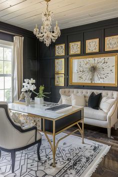 a living room filled with furniture and a chandelier hanging from the ceiling over a table