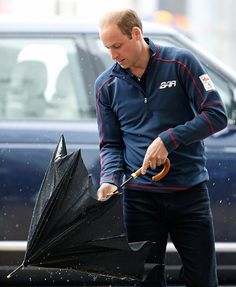 a man holding an umbrella in the rain