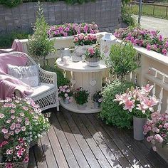 an image of a garden with flowers and plants on the side of a building that is being viewed on instagram