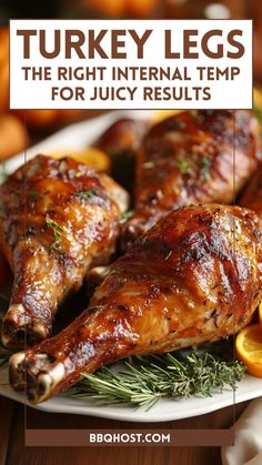 turkey legs on a white plate with oranges and rosemary sprigs in the background