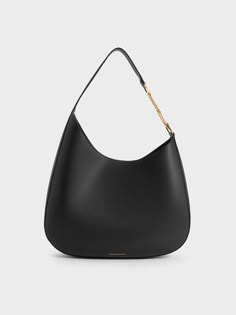 Big bags are back, and this Agatha slouchy hobo bag is certainly deserving of your attention. This bag features soft, rounded corners and an asymmetrical curved design to create an effortlessly stylish lool. Designed to sit comfortably on your shoulder with the thick shoulder strap, the thoughtfully placed curved design also offers a good drop length that allows you to access your items easily. The roomy interior will definitely hold more than just the essentials while the magnetic closure ensures security. Slouchy Hobo Bag, Charles Keith, Big Bags, Kids Sale, Printables Kids, Hobo Bag, Magnetic Closure, Rounded Corners, Sales Gifts