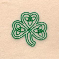 an embroidered shamrock on a white background