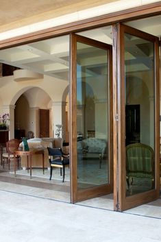 an open living room and dining area with sliding glass doors