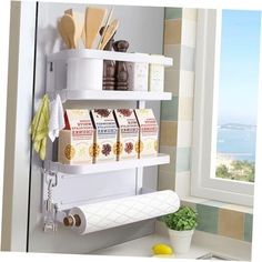 there is a shelf that has some items on it in the kitchen next to a window