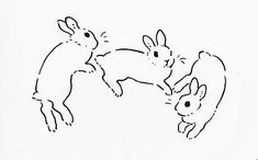 two rabbits playing with each other in black and white ink, on a sheet of paper