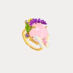 Indulge in the magical beauty of our Pink Crystal Lavender Butterfly Ring. With a stunning pink crystal at its center, surrounded by delicate lavender accents and butterfly motifs, this ring exudes love, romance, and an energy of tranquility. Dressing up your hand with such a bright and colorful floral ring will easily bring joy and energy to your look. Let it inspire you and add a touch of enchantment to any outfit. DETAILS Plating: 18K Gold Materials: 18K Gold on Brass, Enamel, Gemstones, Pear Pink Flower Ring For Spring Wedding, Pink Spring Anniversary Jewelry, Spring Wedding Pink Flower Ring, Luxury Pink Flower Ring For Gift, Luxury Pink Flower Ring Gift, Spring Pink Flower Ring Gift, Elegant Spring Jewelry With Butterfly Charm, Elegant Pink Butterfly Ring, Pink Ring As Spring Season Gift