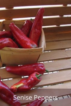 some red peppers are in a basket on a wooden table with the words sense peppers above them