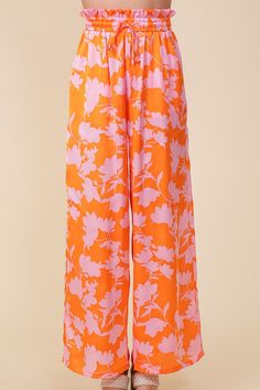 FEATURING LIGHTWEIGHT WOVEN FABRIC AND A WIDE-LEG DESIGN, THIS LOVELY TROPICAL PRINT PANTS OFFER A FLOWY FIT MEANT FOR FUN IN THE SUN. A MUST HAVE FOR YOUR SUMMER CLOSET! * ALL OVER LARGE SIZE TROPICAL PRINTS * LIGHTWEIGHT MATERIAL * SELF TIE DRAWSTRING WITH ELASTIC WAISTBAND * WIDE FIT * FULL LENGTH * THE MODEL IS 5'9" AND WEARING SIZE SMALL Tropical Silhouette, Breezy Aesthetic, Flowy Wide Leg Pants, Print Pant, Tropical Prints, Summer Closet, Printed Wide Leg Pants, Pants Fit, Flowy Pants