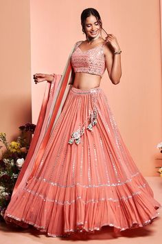 Buy #coral #pink resham embroidered #lehenga in foil mirror work. Paired with a embroidered blouse and ombre dupatta by #Rouje at #AzaFashions at #Rouje at #AzaFashions Shop online now at #Azafashions.com Call +91 8291990059 or email contactus@azafashions.com for enquiries. #wedding #festive #ethnic #tradional #shopping #shoponline #party #reception #bride Trendy Lehenga Designs, Mirror Lehenga, Orange Lehenga, Indian Wedding Lehenga, Mirror Work Lehenga, Groom Dress Men, Bridal Lehenga Designs, Pearl Work, Work Lehenga