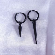 Long black spikes completely embody Jk's style and aura! Black earrings are harder to find, so I'm excited to add these ones to the list. Hoops are electroplated stainless steel, therefore hypoallergenic. They measure about 2 inches long, including the spike. All items come from a smoke free, kitty friendly home. ***Please note that monitor settings can differ, and colors may vary slightly!*** Black Metal Emo Earrings, Alternative Style Nickel-free Black Earrings, Alternative Style Black Nickel-free Earrings, Nickel Free Black Alternative Earrings, Black Punk Jewelry With Spikes, Edgy Black Earrings For Streetwear, Adjustable Black Metal Piercings, Black Metal Punk Hoop Earrings, Alternative Style Black Earrings For Gift