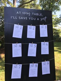 a sign that has been set up with notes attached to it and the words at every table, i'll save you a seat