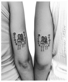 two people with matching tattoos on their arms