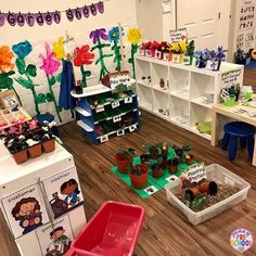 the children's room is filled with potted plants