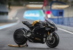 a black and gold motorcycle is parked on the street