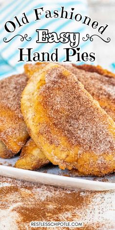 old fashioned easy hand pies on a white plate with powdered sugar and cinnamon