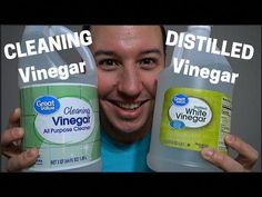 a man holding two gallon jugs of vinegar next to each other with the words cleaning vinegar on them