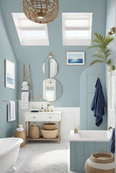 a bathroom with blue walls and white fixtures