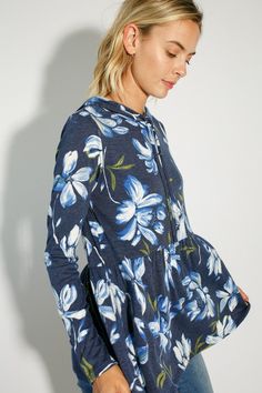 FLORAL PRINT JERSEY BABYDOLL WITH HOODIE CASUAL TOP- Floral print jersey babydoll with hoodie casual top- Long sleeve- Hoodie with self drawstring- Relaxed fit tunic length- Floral print jersey- Model is 5' 8" 31-24-35 and wearing a Small- 87% POLYESTER, 10% RAYON, 3% SPANDEX- MADE IN U.S.A Style: Casual Print / Pattern: Floral print Fit: Relaxed fit Embellishment: Hoodie Sleeve: Long sleeve Lining: No Made In: United StatesFabric Contents: 86% POLYESTER, 10% RAYON, 4% SPANDEXNon-sheer fabricCare Instructions: Machine wash cold, Do not bleachSize Measurement (inch): S: 36.0-38.0 (Bust), null (Waist), null (Hips), null (Length) M: 38.0-40.0 (Bust), null (Waist), null (Hips), null (Length) L: 40.0-42.0 (Bust), null (Waist), null (Hips), null (Length) Casual Spring Hoodie Top, Casual Floral Print Tops For Winter, Blue Long Sleeve Top With Drawstring Hood, Casual Long Sleeve Tops With Drawstring Hood, Blue Floral Print Top For Winter, Blue Floral Print Tops For Winter, Winter Blue Floral Print Tops, Hooded Spring Loungewear Top, Blue Cotton Drawstring Tops