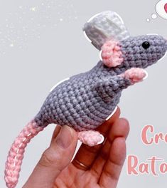 a crocheted rat toy in the palm of someone's hand with a thought bubble above it