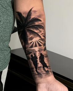 a person with a tattoo on their arm holding onto a palm tree and two people