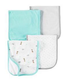 three baby bibs in different colors and designs, one with giraffes on it