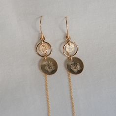 🌺90's style hibiscus motifs are hand-stamped onto gold filled discs with an added threader to leave swinging or as a second hole threader earring Fun and dramatic motion for a dainty statement! Height approximately 1 3/8" - 3" long depending on how you choose to wear it 14k Gold Filled Threader Earrings, Adjustable Gold Earrings With Dangling Charms, Adjustable 14k Gold Dangle Threader Earrings, Gold Earrings With Dangling Charms, Threader Earrings, 14kt Gold, You Choose, 90s Fashion, Hand Stamped