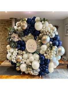 a wreath made out of balloons and other decorations