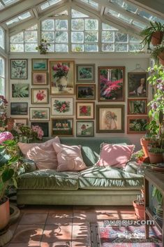 a living room filled with lots of plants and pictures