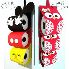 two different colored toilet paper holders with mickey and minnie mouse faces on them, hanging from the wall