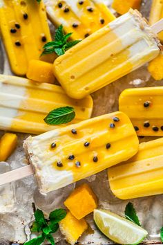 popsicles with lemons and mint on them are ready to be dipped in ice cream