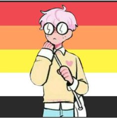 a person with pink hair and glasses standing in front of a rainbow flag