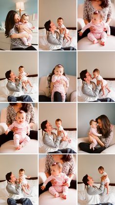 a woman holding a baby while sitting on top of a bed