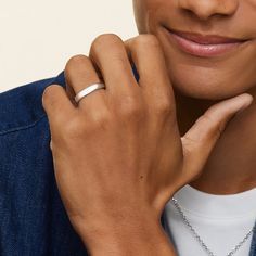 a close up of a person wearing a ring