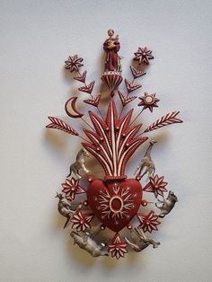 a red and white clock on the wall with an image of a woman holding a heart