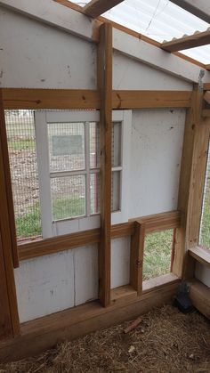 the inside of a chicken coop with windows