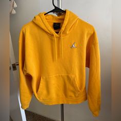 Womens Yellow Jordan Hoodie Size Xs **New Without Tags** Cut Off Tags Prematurely Thick, Heavyweight Fleece Fabric Loose And Roomy Fit Retails $88 Item Comes From Pet Free & Smoke Free Home I Offer Bundle Packaging Discounts Also, Feel Free To Make Me An Offer!!!! Happy Shopping! :-) Winter Sportswear Yellow Hoodie, Bundle Packaging, Jordan Hoodie, Yellow Hoodie, Womens Jordans, Fleece Fabric, Air Jordans, Happy Shopping, Womens Tops