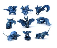 the blue figurines are all different shapes and sizes, including one with wings