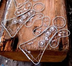 several pieces of wire sitting on top of a wooden table