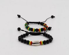 These lovely, Jamaican rasta color bead bracelets were handmade in West Africa. This versatile wrist wear represents a symbol of a connection to the birthplace of humankind and can be used as an accessory to add a splash of color to any outfit. The length is conveniently adjustable for men, women and teens.  In stock. Fast shipping from Dallas, TX. Adjustable Wristband With Black Round Beads, Adjustable Black Beads Wristband, Casual Friendship Bracelets With Black Beads As Gift, Casual Black Beads Wristband Gift, Hand Wrapped Black Beaded Bracelets For Beach, Spiritual Black Beaded Bracelets For Beach, Handmade Black Wristband For Beach, Handmade Black Wristband For The Beach, Adjustable Black Wristband With Colorful Beads